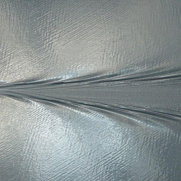 Aerial photo of a boat and the wake trailing behind it.