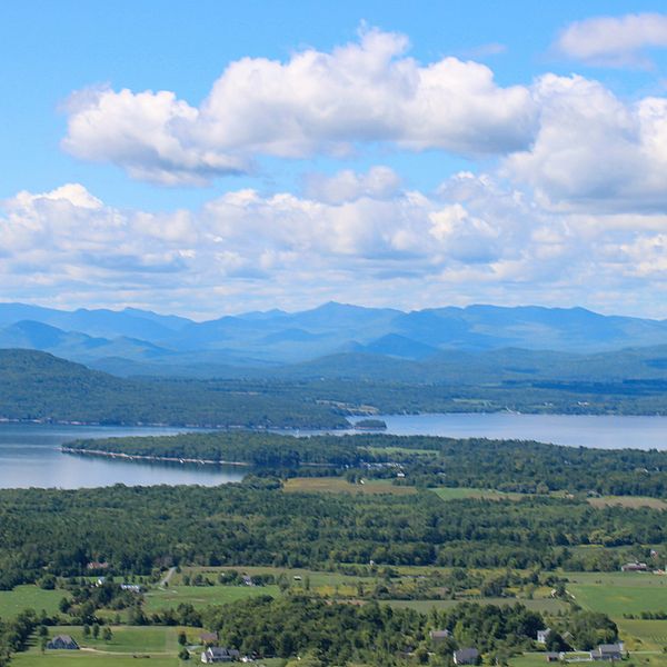Photo of Lake Champlain and the Adirondack Mountains as seen from Mt. Philo in Vermont. Photo by Lisa Cicchetti.